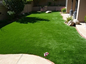 neat backyard synthetic grass after installtion
