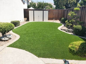 neatly installed backyard artificial grass